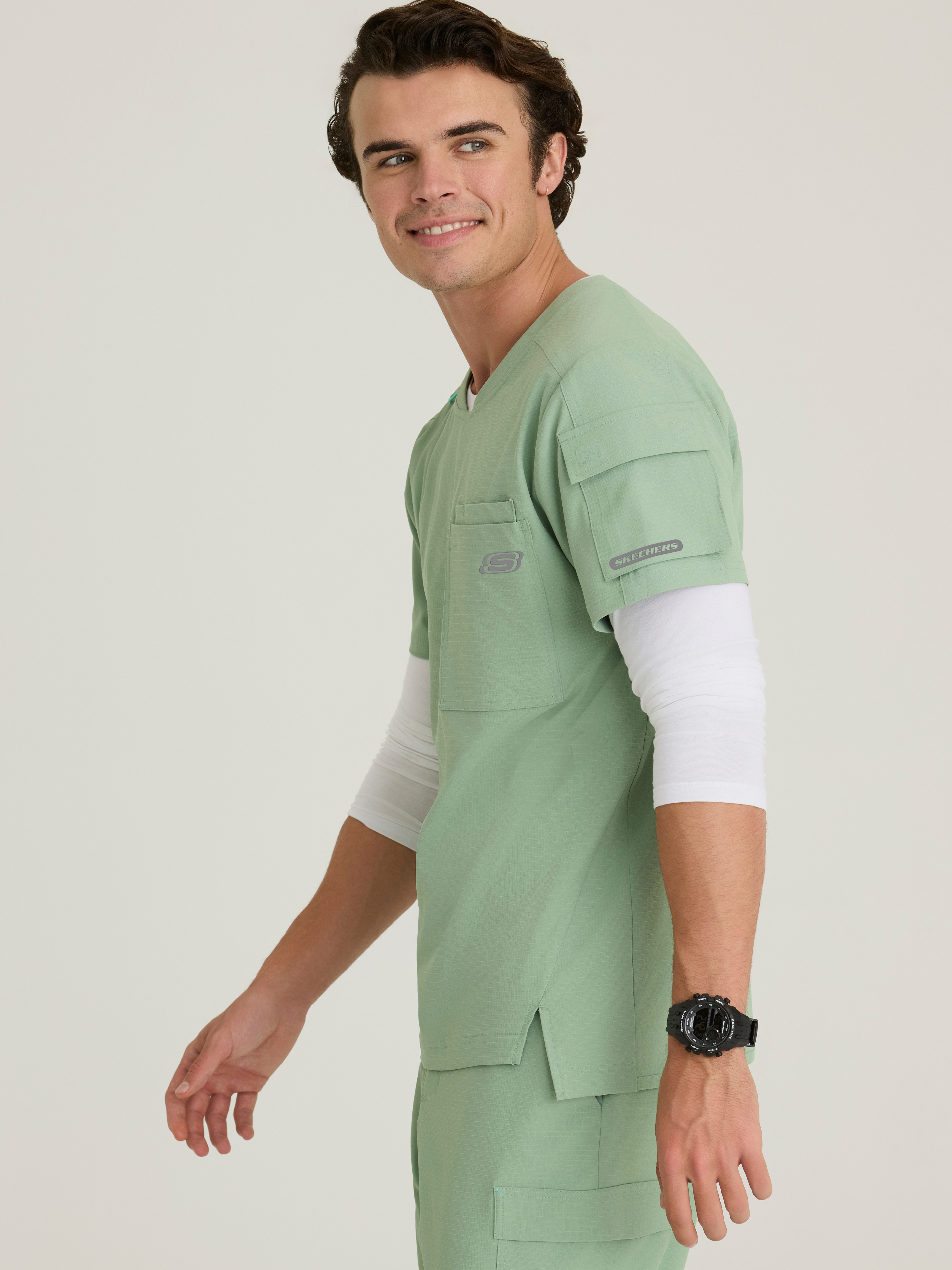 Station 3-Pocket Round Neck High-Low Hem Top Skechers™ by BARCO® Ripstop